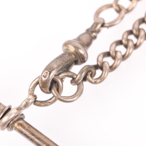 1451 - An Antique silver graduated solid curb link Albert chain necklace, with silver T-bar and dog clip, 3... 