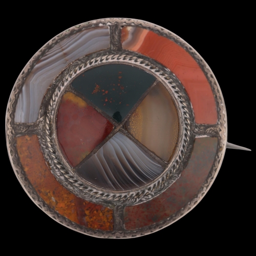 1464 - A 19th century Scottish hardstone shield brooch, unmarked silver set with banded agate bloodstone ja... 