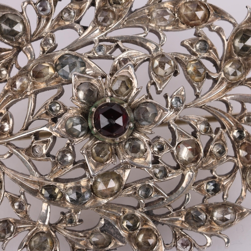 1467 - A large 19th century silver garnet and jargoon floral brooch, with engraved closed-back settings, un... 