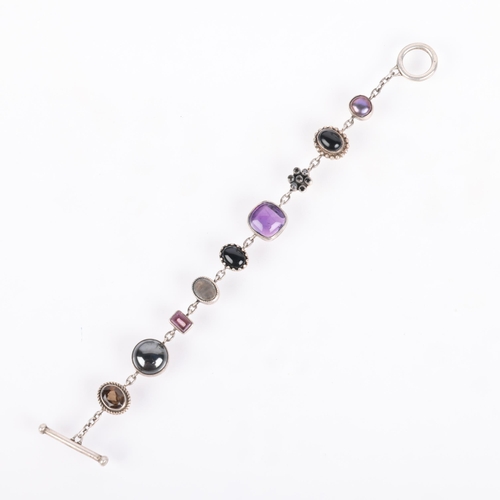 1470 - A sterling silver gem set line bracelet, indistinct maker, gemstones include hematite amethyst onyx ... 