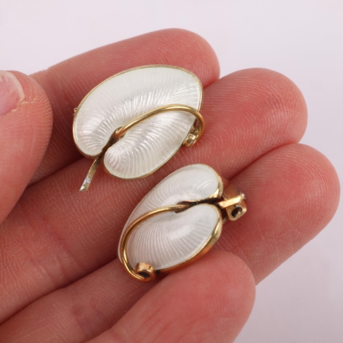 1495 - VOLMER BAHNER - a pair of Danish modernist sterling silver-gilt white enamel leaf clip-on earrings, ... 