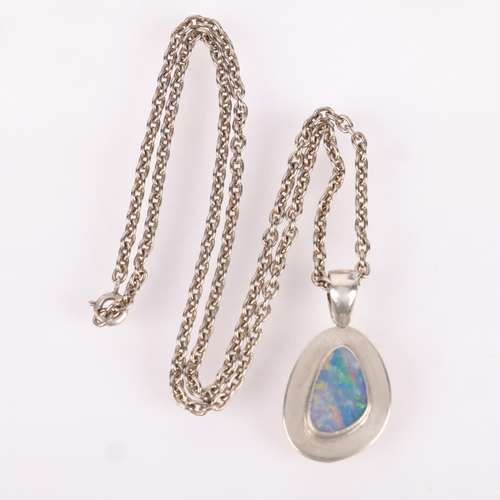 1496 - A modernist sterling silver opal doublet pendant necklace, no maker, on unmarked silver cable link c... 