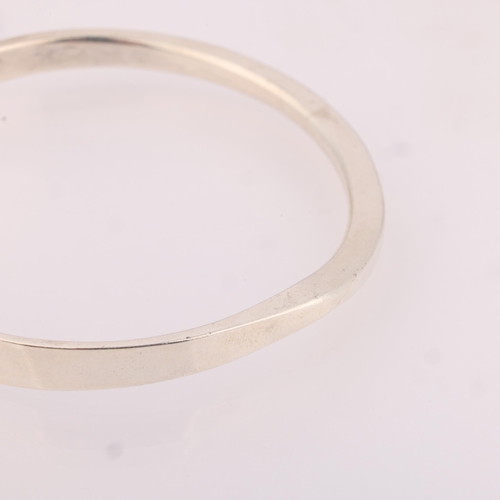 1507 - FRANK HAM - a Danish modernist sterling silver slave bangle, plain form with notched edge, model no.... 