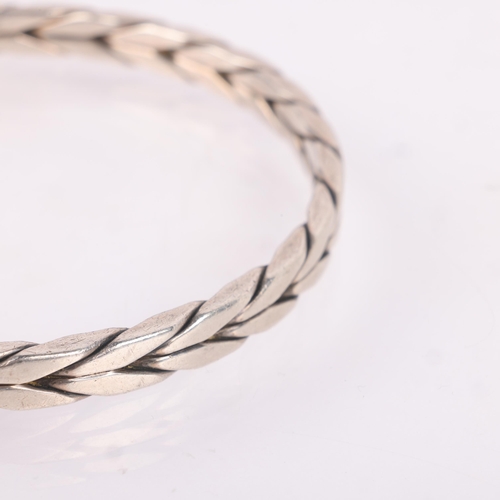 1519 - RANDERS SOLVVAREFABRIK - a Danish modernist sterling silver slave bangle, plain woven form, band wid... 