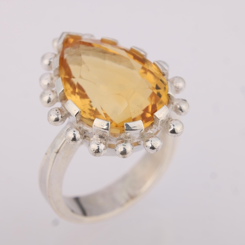 1541 - A heavy sterling silver citrine dress ring, set with pear-cut citrine, setting height 20mm, size R, ... 