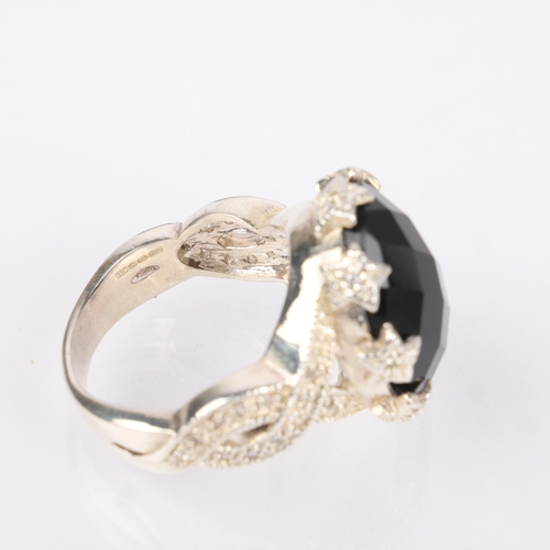 1543 - A heavy sterling silver onyx and cubic zirconia dress ring, setting height 17.4mm, size V, 14.2g