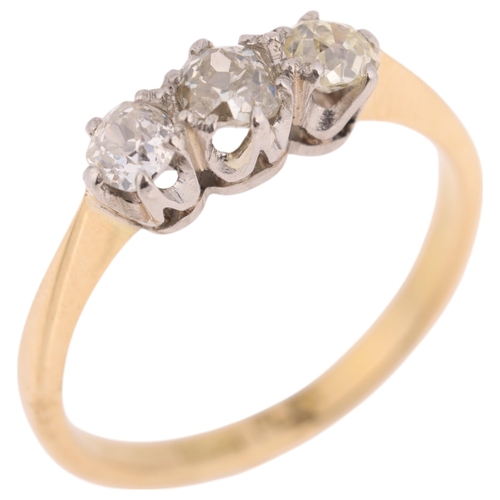 1371 - An 18ct gold three stone diamond ring, platinum-topped set with old-cut diamonds, total diamond cont... 