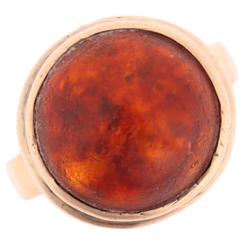 1378 - **WITHDRAWN**A Vintage 9ct gold amber dress ring, maker L & Co, Birmingham 1956, set with round cabo... 