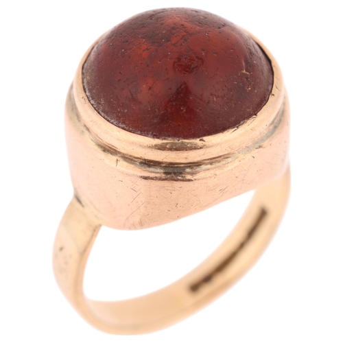 1378 - **WITHDRAWN**A Vintage 9ct gold amber dress ring, maker L & Co, Birmingham 1956, set with round cabo... 