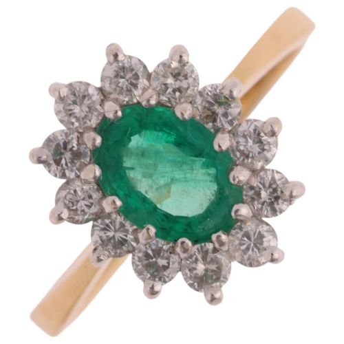 1380 - An 18ct gold emerald and diamond cluster ring, London 1989, claw set with oval mixed-cut emerald and... 