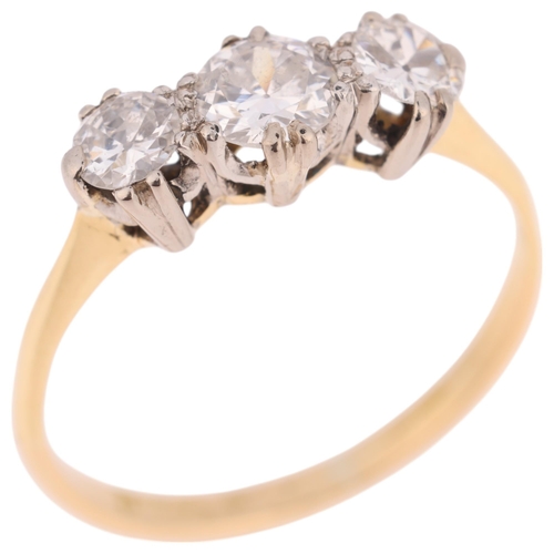 1383 - An 18ct gold three stone diamond ring, set with round transitional-cut diamonds, total diamond conte... 