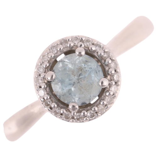 1384 - A 9ct white gold blue topaz and diamond halo cluster ring, setting height 8.4mm, size L, 2.7g