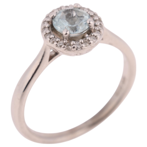 1384 - A 9ct white gold blue topaz and diamond halo cluster ring, setting height 8.4mm, size L, 2.7g