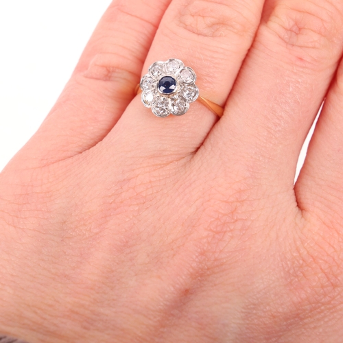 1386 - An 18ct gold sapphire and diamond flowerhead cluster ring, platinum-topped set with round-cut sapphi... 