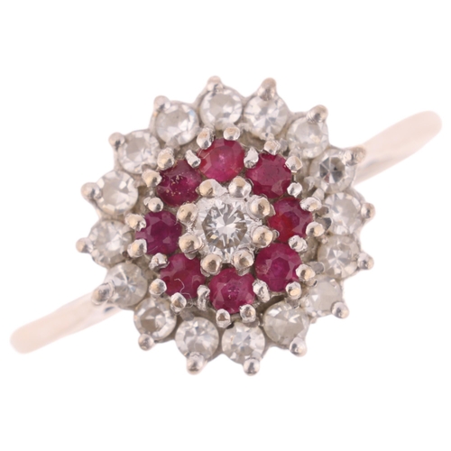 1389 - An 18ct gold ruby and diamond cluster ring, set with round-cut rubies and modern round brilliant-cut... 