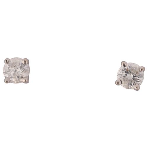 1393 - A pair of 18ct white gold 0.2ct single stone diamond stud earrings, each claw set with 0.1ct modern ... 