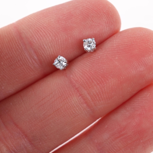 1393 - A pair of 18ct white gold 0.2ct single stone diamond stud earrings, each claw set with 0.1ct modern ... 