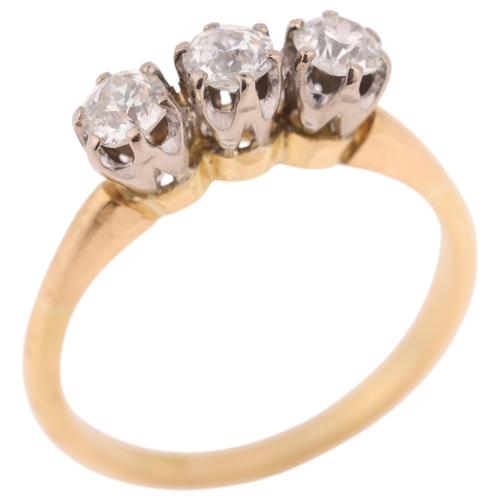 1395 - An 18ct gold three stone diamond ring, claw set with old European-cut diamonds, total diamond conten... 