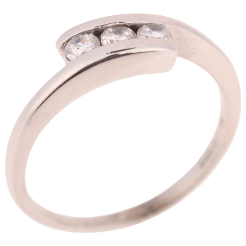 1398 - A 9ct white gold three stone cubic zirconia crossover ring, setting height 5.2mm, size N, 2.4g