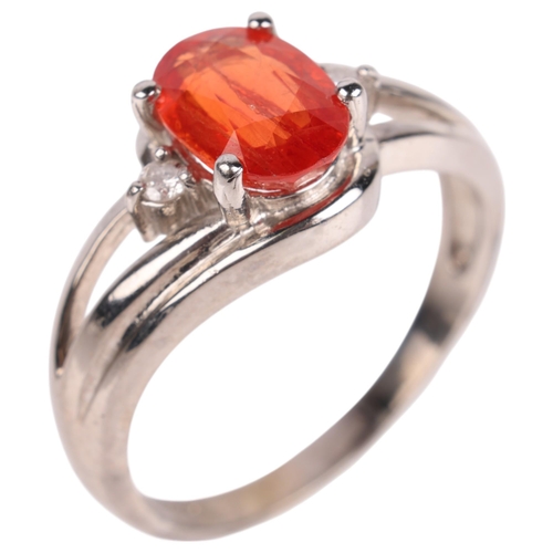 1405 - An 18ct white gold spessartine orange garnet and diamond dress ring, maker GTV, Birmingham 2005, cla... 