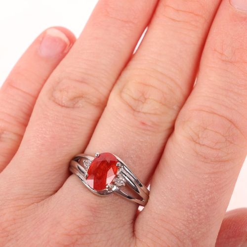 1405 - An 18ct white gold spessartine orange garnet and diamond dress ring, maker GTV, Birmingham 2005, cla... 