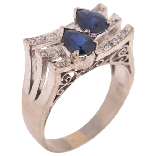 1406 - A 14ct white gold sapphire and diamond cocktail ring, in the Art Deco style, set with pear-cut sapph... 