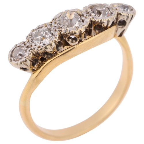 1407 - An 18ct five stone diamond crossover ring, illusion set with old-cut diamonds, total diamond content... 