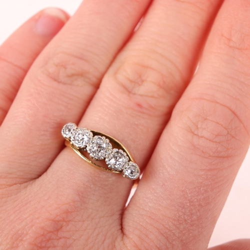 1407 - An 18ct five stone diamond crossover ring, illusion set with old-cut diamonds, total diamond content... 