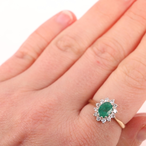 1415 - A 9ct gold emerald and diamond oval cluster ring, claw set with oval mixed-cut emerald and modern ro... 