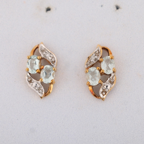 1417 - A pair of 9ct gold aquamarine and diamond stud earrings, set with oval mixed-cut aquamarines and mod... 