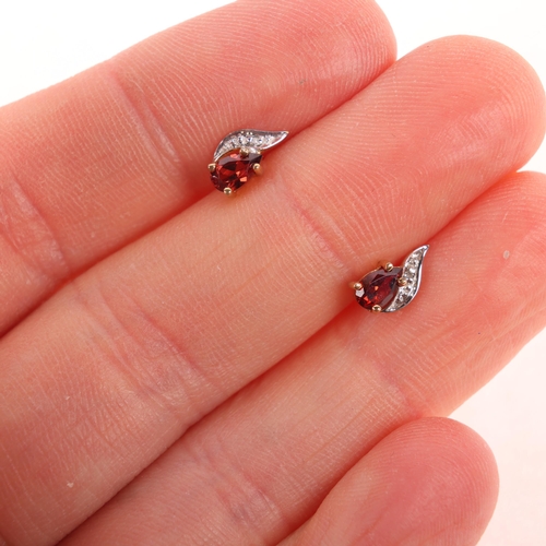 1418 - A pair of 9ct gold garnet and diamond stud earrings, 8.8mm, 0.6g