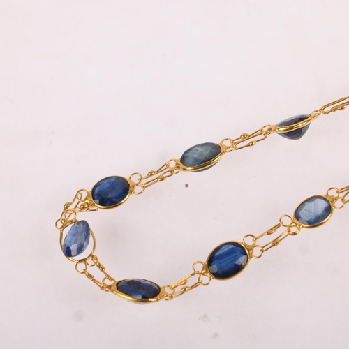 1423 - A 14ct gold sapphire line necklace, set with oval mixed-cut sapphires with double links, 46cm, 3.9g