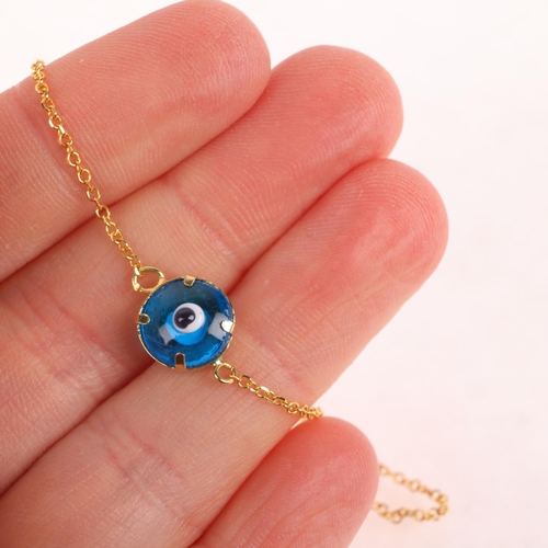 1425 - A 14ct gold blue glass 'Evil Eye' bracelet, 16cm, 1.3g