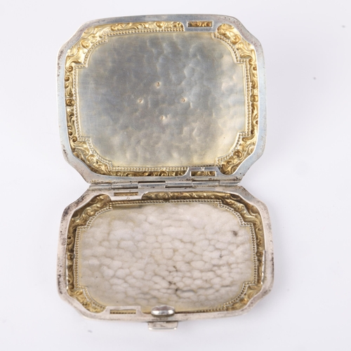 1608 - A Continental silver cigarette case, shaped rectangular form with applied gold monogram, relief embo... 