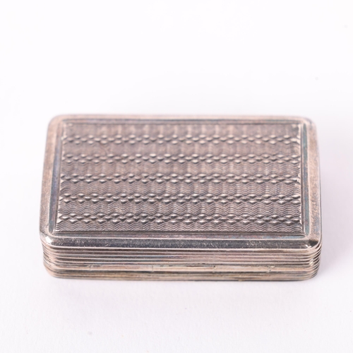 1615 - A George IV silver vinaigrette, maker TS, Birmingham 1829, rectangular form with engine turned decor... 