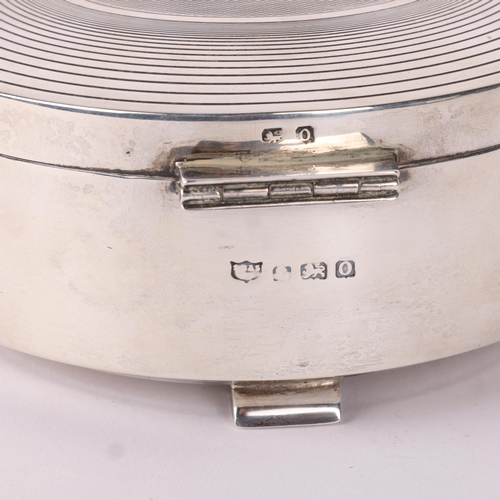 1622 - An Art Deco George VI silver box, S Blanckensee & Sons Ltd, Birmingham 1938, circular form with geom... 