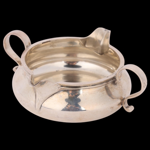 1632 - A late Victorian silver double beak cream jug, John Henry Rawlings, London 1898, circular bulbous fo... 