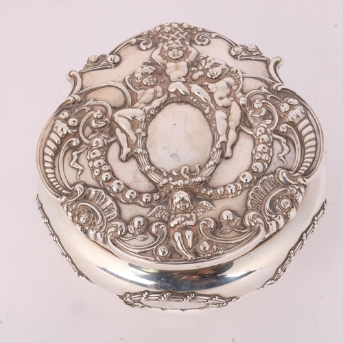 1641 - TIFFANY & CO - an American sterling silver dressing table box and cover, circa 1900, round bulbous f... 