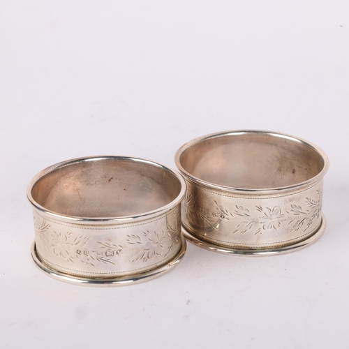 1647 - A cased pair of George V silver napkin rings, Joseph Gloster Ltd, Birmingham 1920, floral engraved d... 