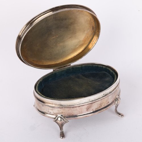 1648 - A George V silver dressing table jewel box, Lee & Wigfull, Sheffield 1927, oval form with engine tur... 