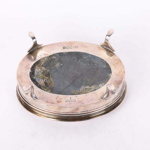 1648 - A George V silver dressing table jewel box, Lee & Wigfull, Sheffield 1927, oval form with engine tur... 