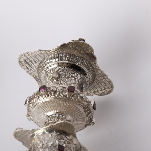 1653 - A set of 4 Austrian gem set silver table candlesticks, Vienna circa 1859, allover relief embossed fo... 