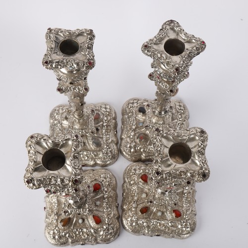 1653 - A set of 4 Austrian gem set silver table candlesticks, Vienna circa 1859, allover relief embossed fo... 