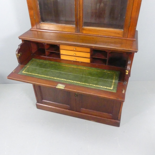 2115 - A late Victorian mahogany two section secretaire bookcase, with two glazed doors, secretaire drawer ... 