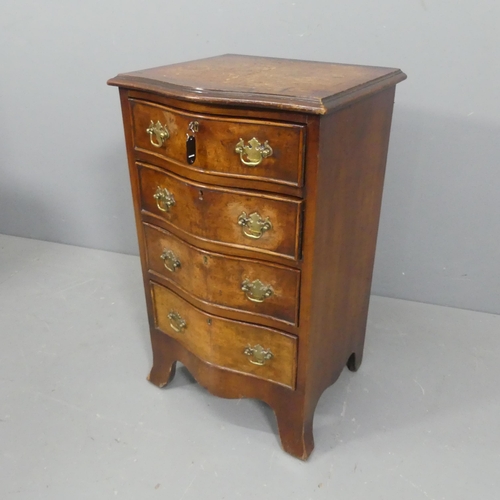 2122 - A 19th century burr-walnut veneered serpentine fronted small chest of four drawers, with brass pulls... 