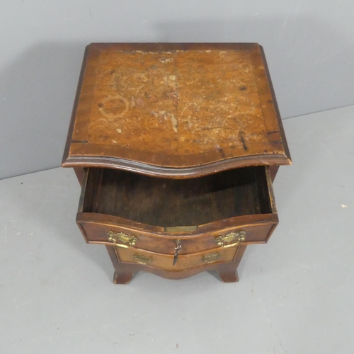 2122 - A 19th century burr-walnut veneered serpentine fronted small chest of four drawers, with brass pulls... 