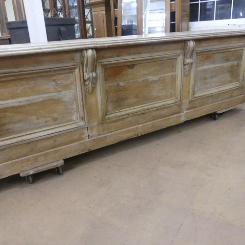 2163 - A Victorian pine pine shop counter, with panelled front and shelved reverse. Length 293cm, height 78... 