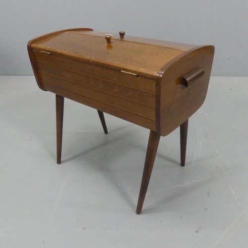 2165 - A mid-century oak sewing cabinet. Width 49cm, height 46cm, depth 28cm.