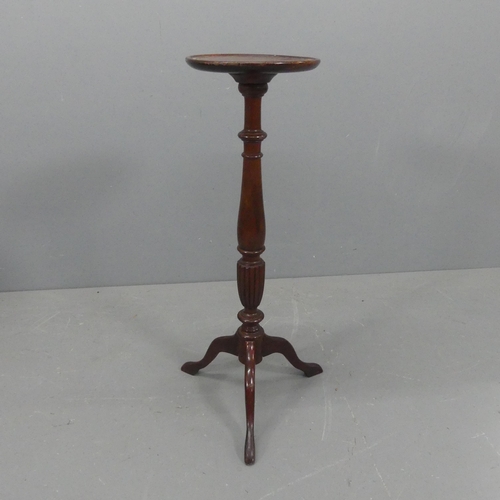 2168 - A mahogany jardinière stand, on turned central column with tripod base. Height 92cm.