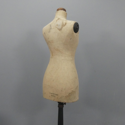 2169 - A vintage shop display mannequin, mounted on painted tripod base and labelled for Stockman's. Height... 